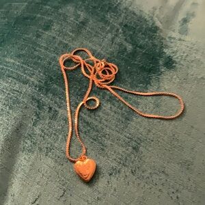 Pretty gold filled heart locket on chain.